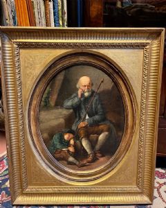Pintor del siglo XIX. Anciano con niño. Óleo sobre tabla ovalada dentro de marco dorado, cm 45x35.