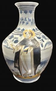 Bottiglia in maiolica a smalto berettino con figura di San Domenico.Faenza.