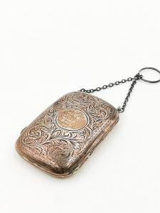 Estuche monedero plateado
    