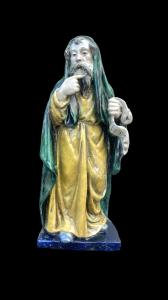 Escultura de mayólica que representa a un filósofo con un pergamino. Fabricación Chigi. San Quirico d'Orcia.